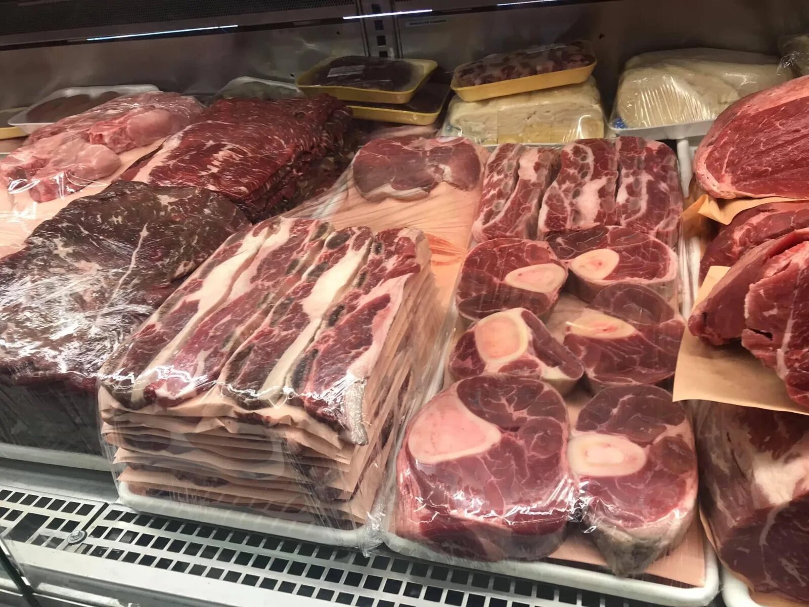 Fresh beef cuts displayed in the Carniceria Camargo butcher case