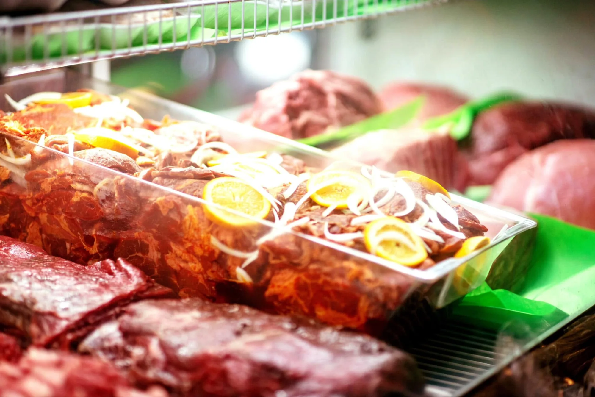 Fresh butcher cuts and marinated meats at Carniceria Camargo