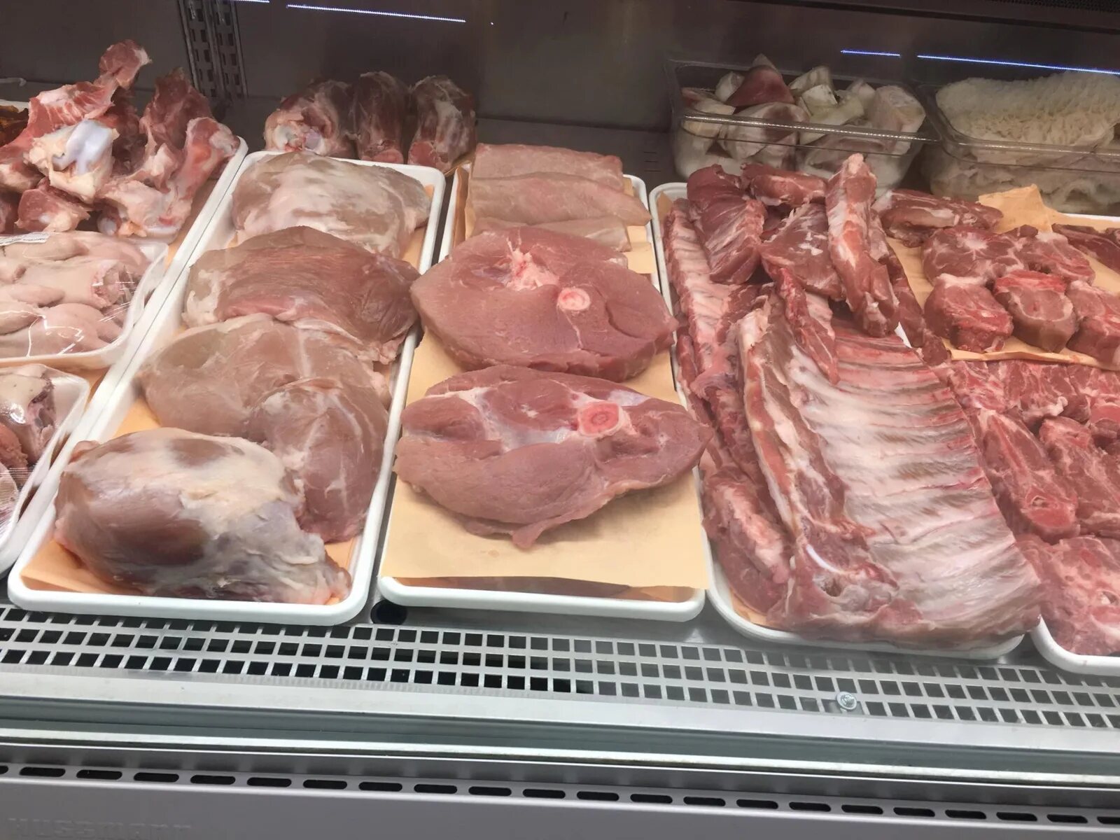 Fresh pork cuts and ribs in the butcher case